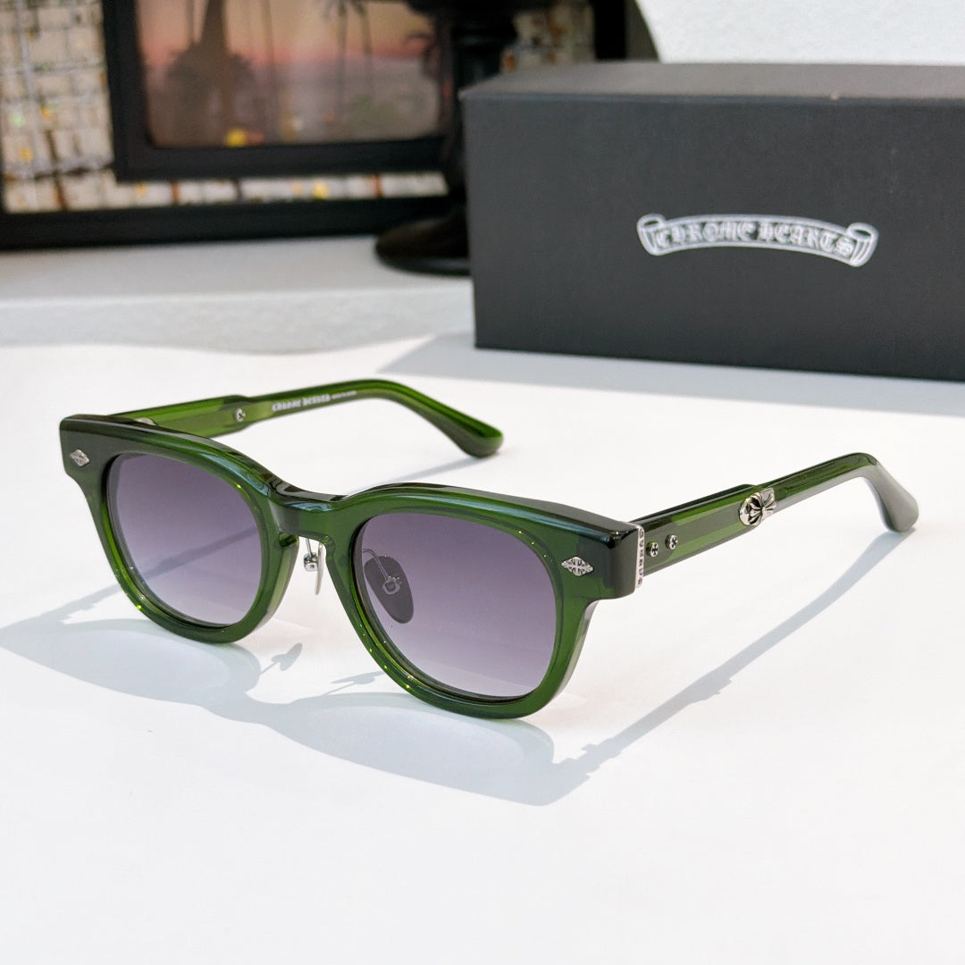 Glasses with green frames and purple-tinted lenses, metal temples