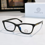 Versace eyeglasses with black acetate frames, clear lenses, blue temple detail, logo.
