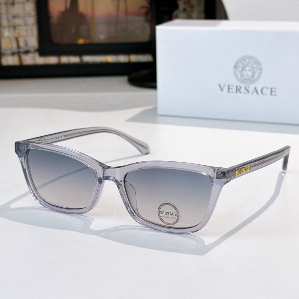 Versace eyeglasses with light gray acetate frames and clear lenses, logo on lens.