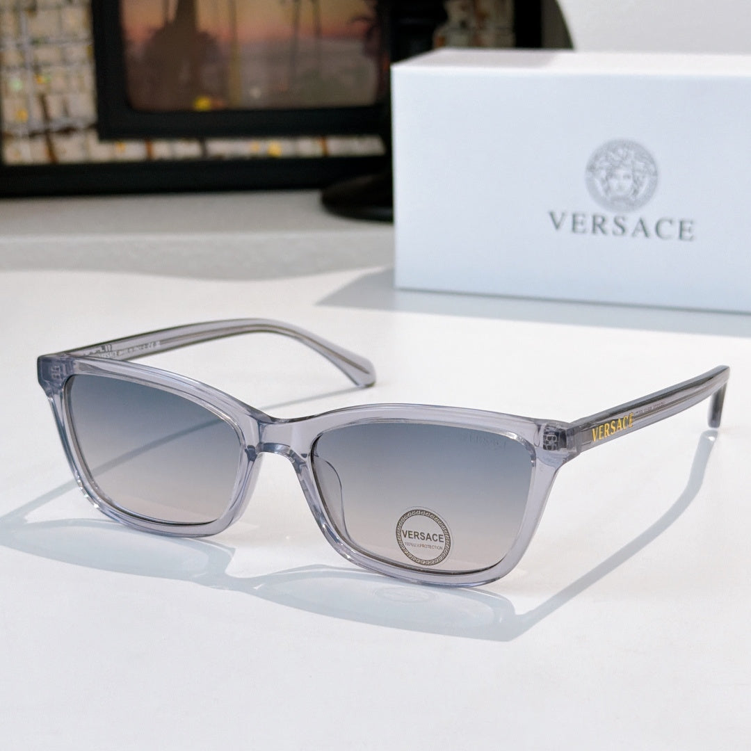 Versace eyeglasses with light gray acetate frames and clear lenses, logo on lens.
