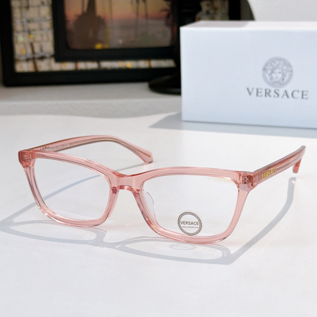 Versace eyeglasses with light pink acetate frames and clear lenses, logo on lens.