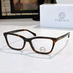Versace eyeglasses with dark tortoise acetate frames and clear lenses, logo on temple.