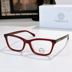 Versace eyeglasses with red acetate frames and clear lenses, logo on lens.