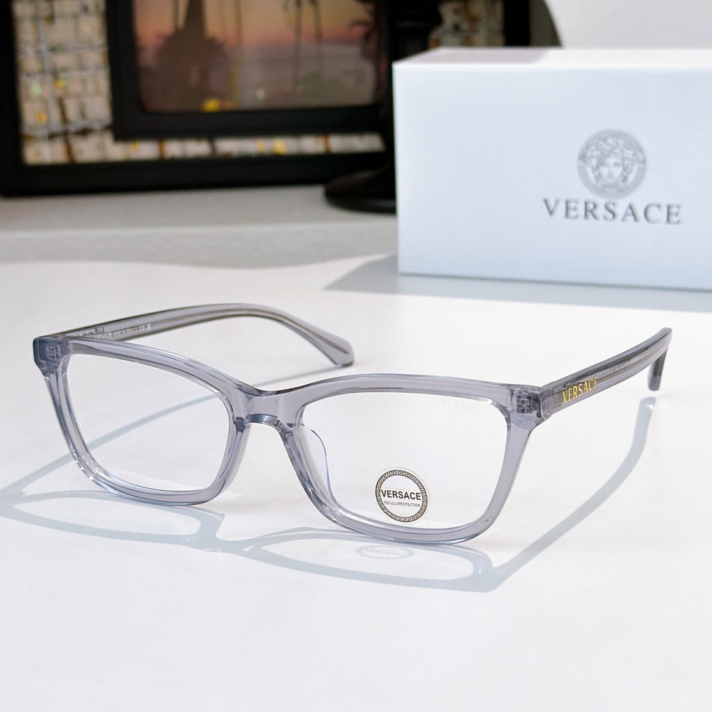 Versace eyeglasses with light blue-gray acetate frames and clear lenses, logo on temple.