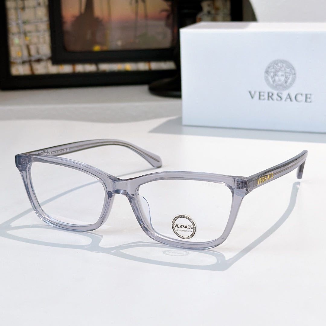 Versace eyeglasses with light blue-gray acetate frames and clear lenses, logo on temple.