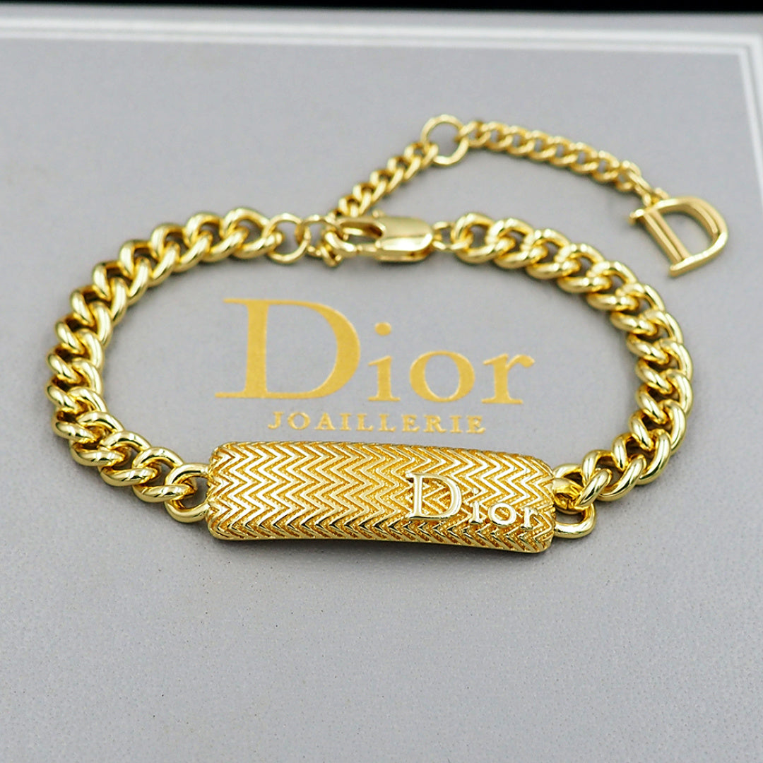 Gold-tone Dior bracelet with textured bar charm and D clasp
