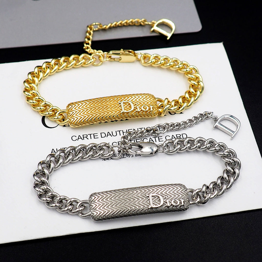 Dior bracelet set: gold and silver chain bracelets with textured bar charms.