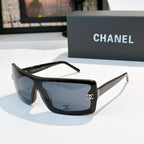 Chanel sunglasses, dark frame with blue lens tint and gold CC logo on temple