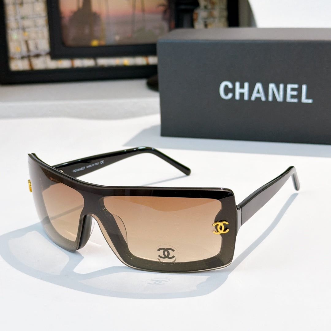 Chanel sunglasses, tortoiseshell frame with tan lens tint and gold CC logo