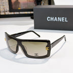 Chanel sunglasses, dark frame with beige lens tint and gold CC logo on temple