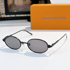 Louis Vuitton sunglasses, dark oval frames with dark lenses and slim temples.