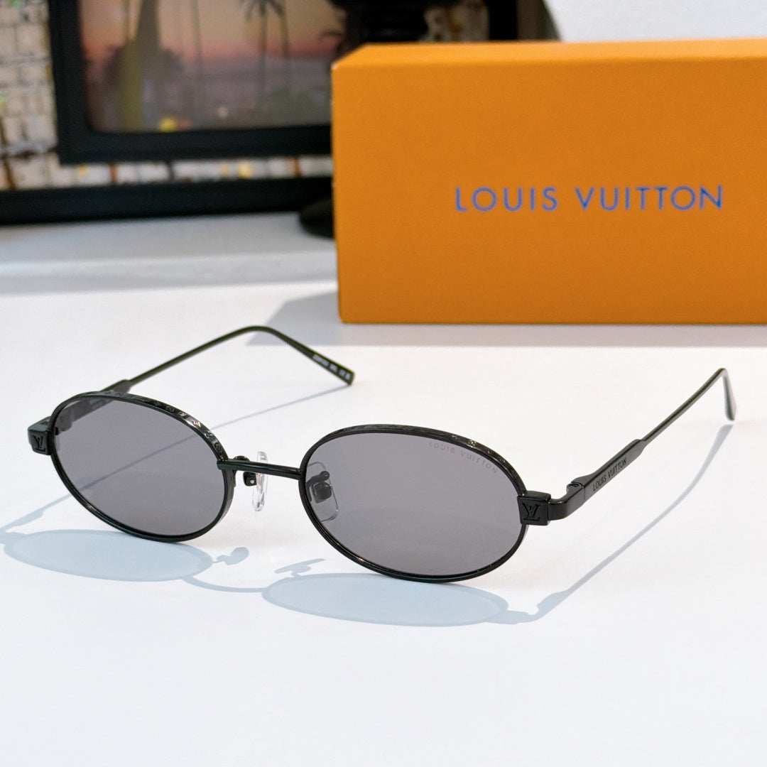 Louis Vuitton sunglasses, dark oval frames with dark lenses and slim temples.