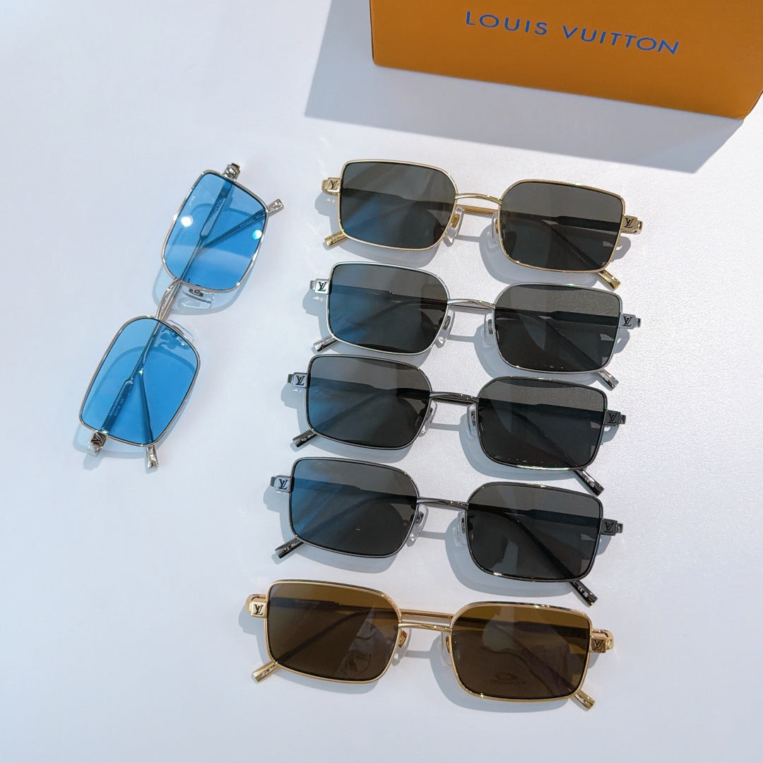 Assorted sunglasses with blue, black, and brown lenses, stacked in a group