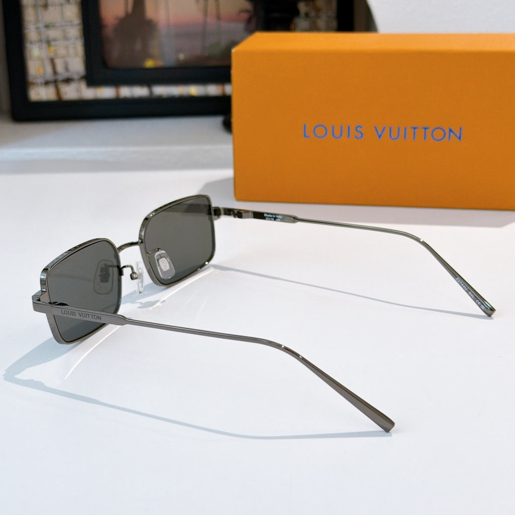 Silver-tone sunglasses with dark lenses, side profile view with straight arms