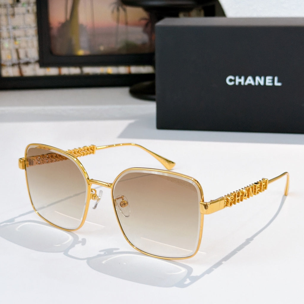 Chanel gold-tone square sunglasses with light lenses and textured logo temple detail