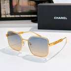 Chanel gold-tone square sunglasses with blue-tinted lenses and textured logo temples