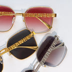 Chanel sunglasses close-up: red, black, and gray lenses with gold and silver logo temples