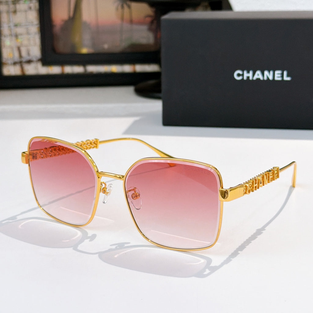 Chanel gold-tone square sunglasses with pink-tinted lenses and logo temple detail
