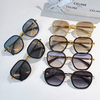 Set of round sunglasses with gold hardware and varied frames: blue, black, and burgundy