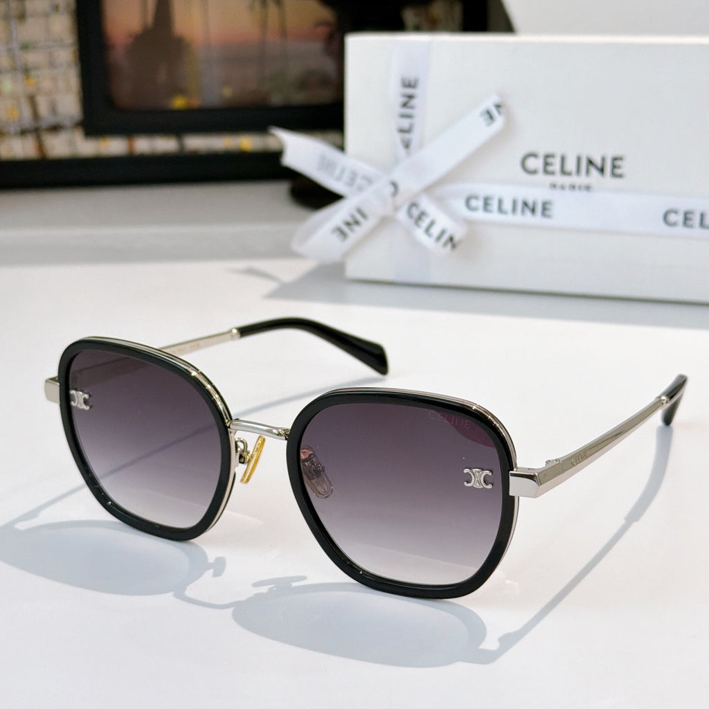 Round sunglasses with dark frame and gold accents, purple gradient lenses