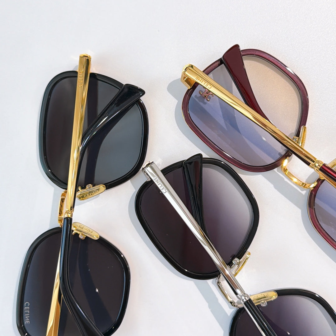 Assorted sunglasses with gold frames and dark lenses, including black and burgundy styles