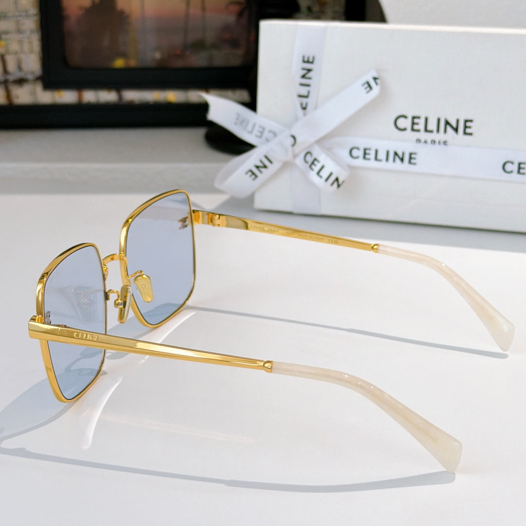 Celine sunglasses, gold frame with pale blue lenses, temple side view