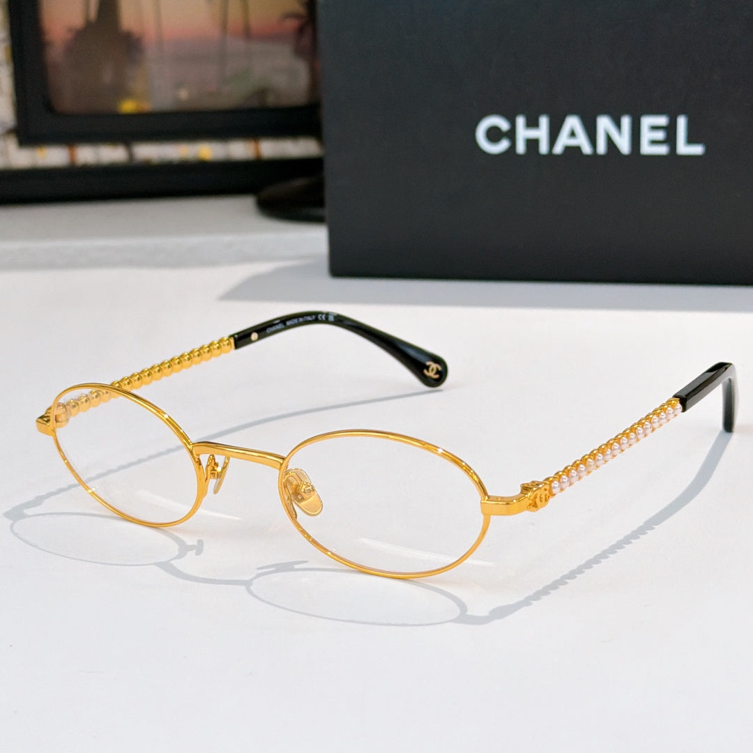 Gold round eyeglasses with clear lenses and beaded chain temples