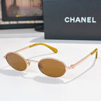 Rose-gold round sunglasses with brown lenses and beaded chain temples
