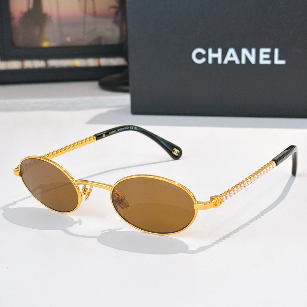 Gold round sunglasses with brown lenses and beaded chain temples