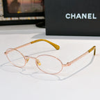 Rose-gold round eyeglasses with clear lenses and beaded chain temples