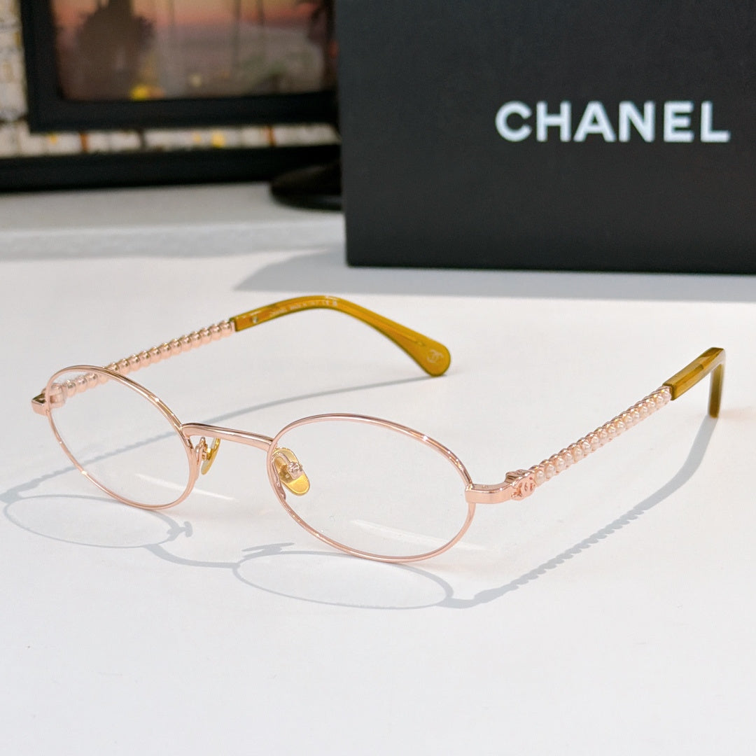 Rose-gold round eyeglasses with clear lenses and beaded chain temples