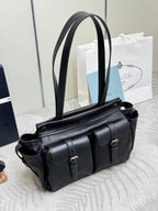 Prada black leather satchel bag with long strap and front buckles