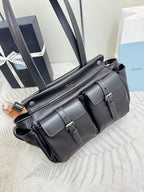 Prada black leather bag with stitched front panel and two buckle straps