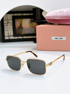 MiuMiu glasses with dark gray lenses and gold square frame