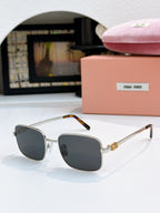 MiuMiu glasses with dark gray-blue lenses and silver frame