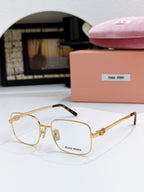 MiuMiu glasses with clear lenses and gold square frame