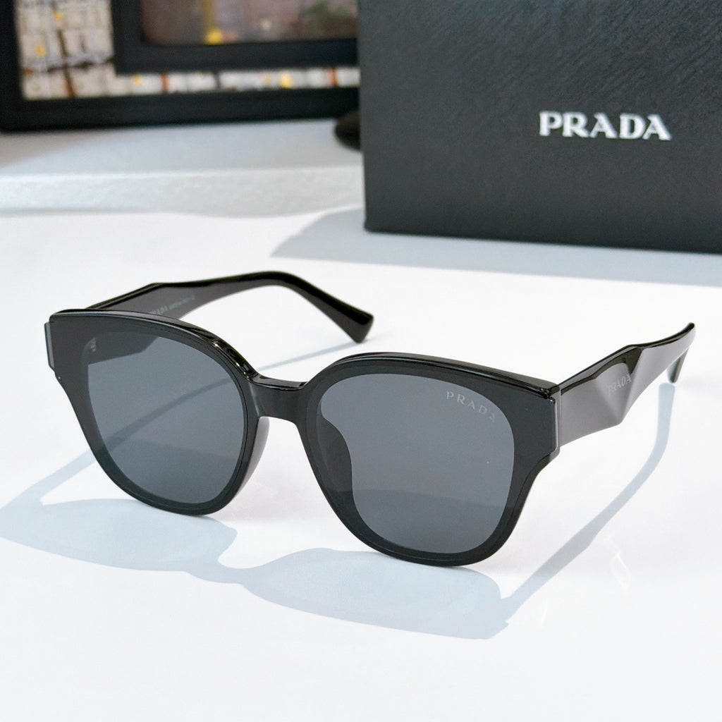 Prada black cat-eye sunglasses with dark tinted lenses