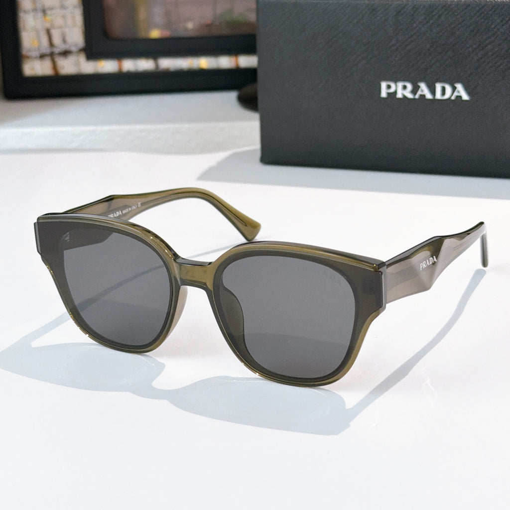 Prada olive and gray cat-eye sunglasses with dark tinted lenses