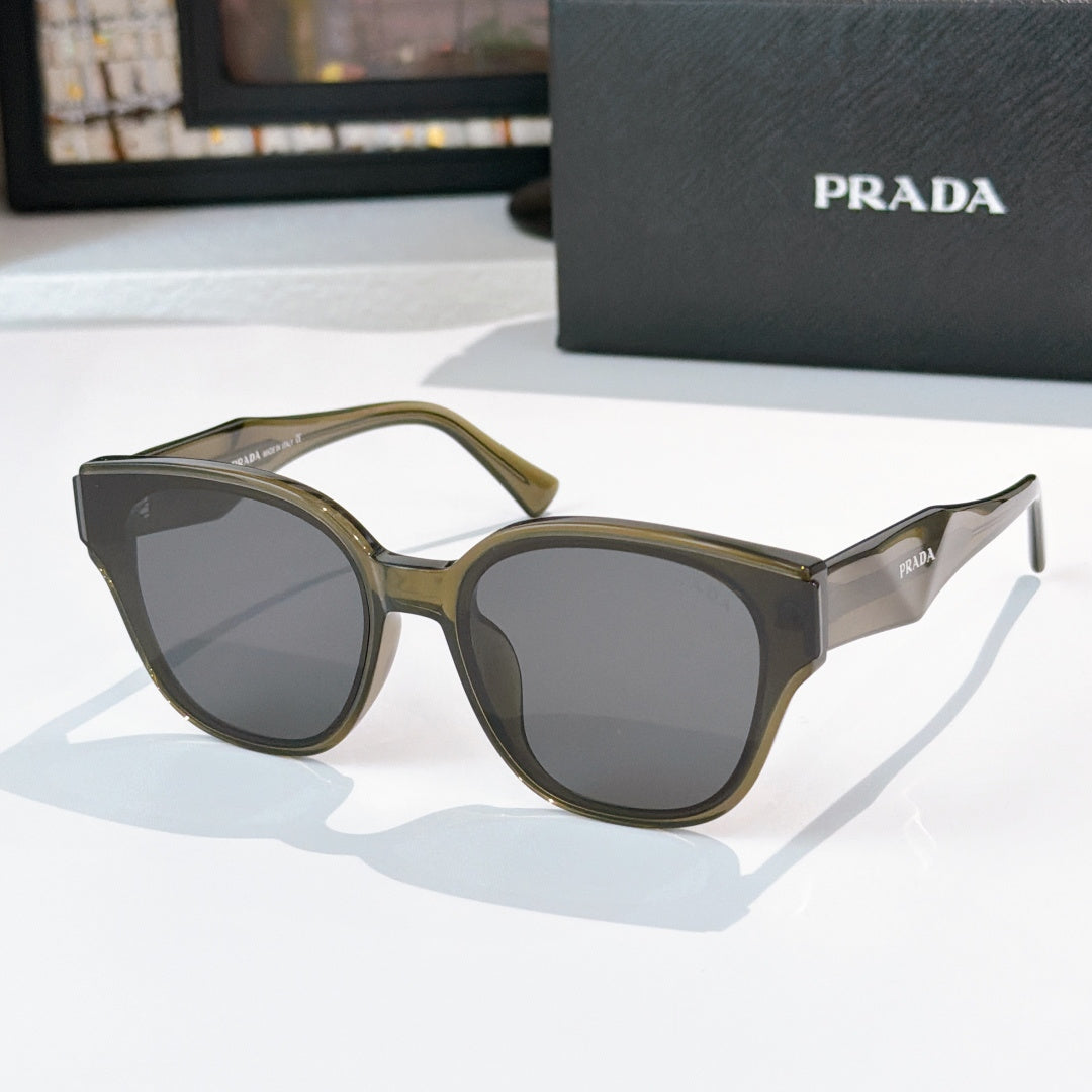 Prada olive and gray cat-eye sunglasses with dark tinted lenses