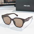 Prada dark gray cat-eye sunglasses with brown tinted lenses