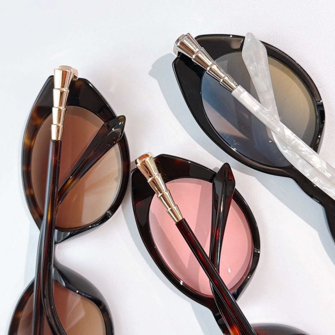 Bvlgari sunglasses with tortoise-dark frames and pink gradient lenses, gold bar temples