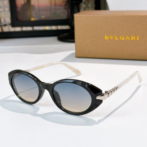 Bvlgari sunglasses with black frames and dark blue round lenses, gold bridge