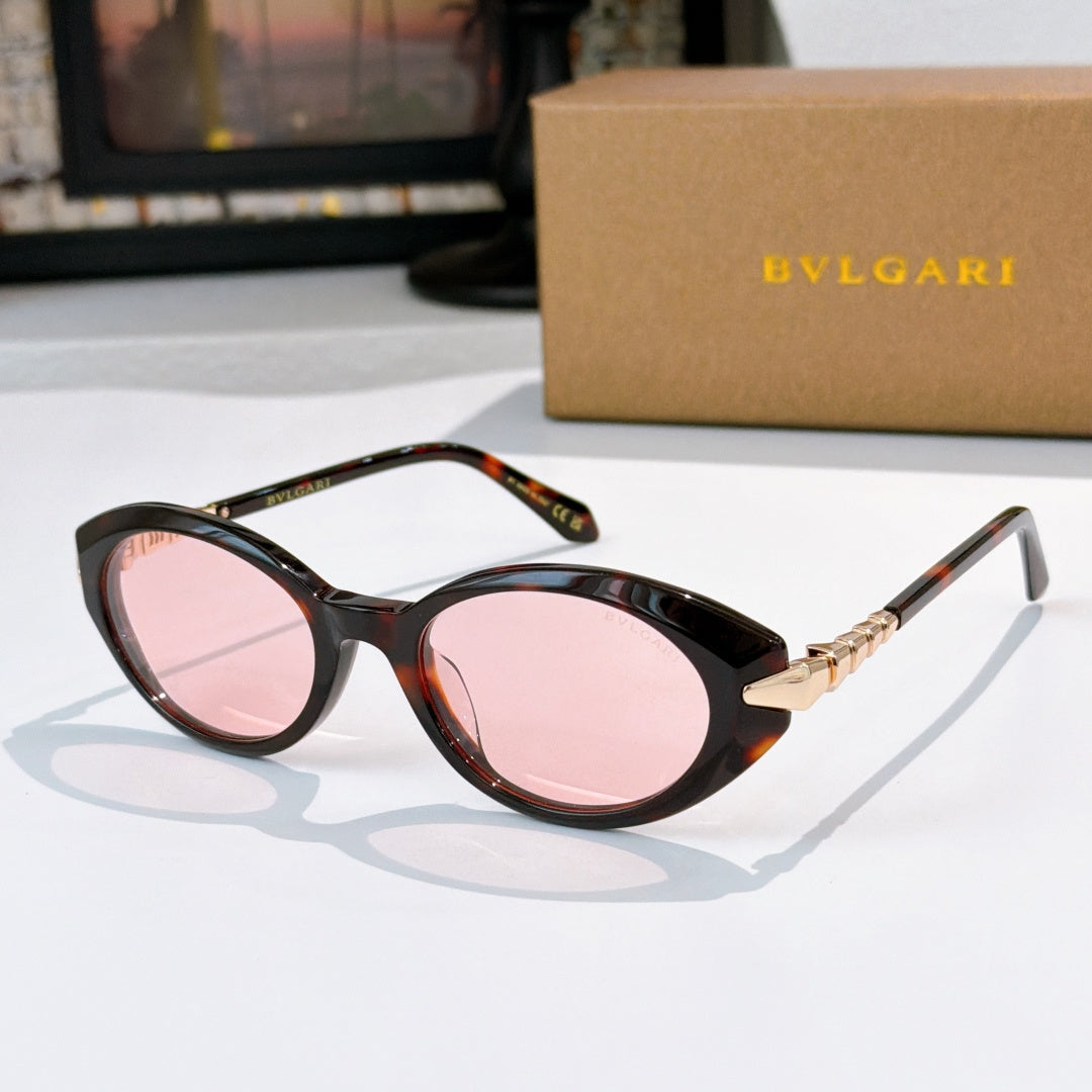 Bvlgari sunglasses with dark tortoise frames and pink oval lenses, gold bridge