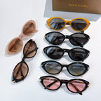 Bvlgari sunglass collection with pink, black, yellow, and tortoise frames, assorted lenses