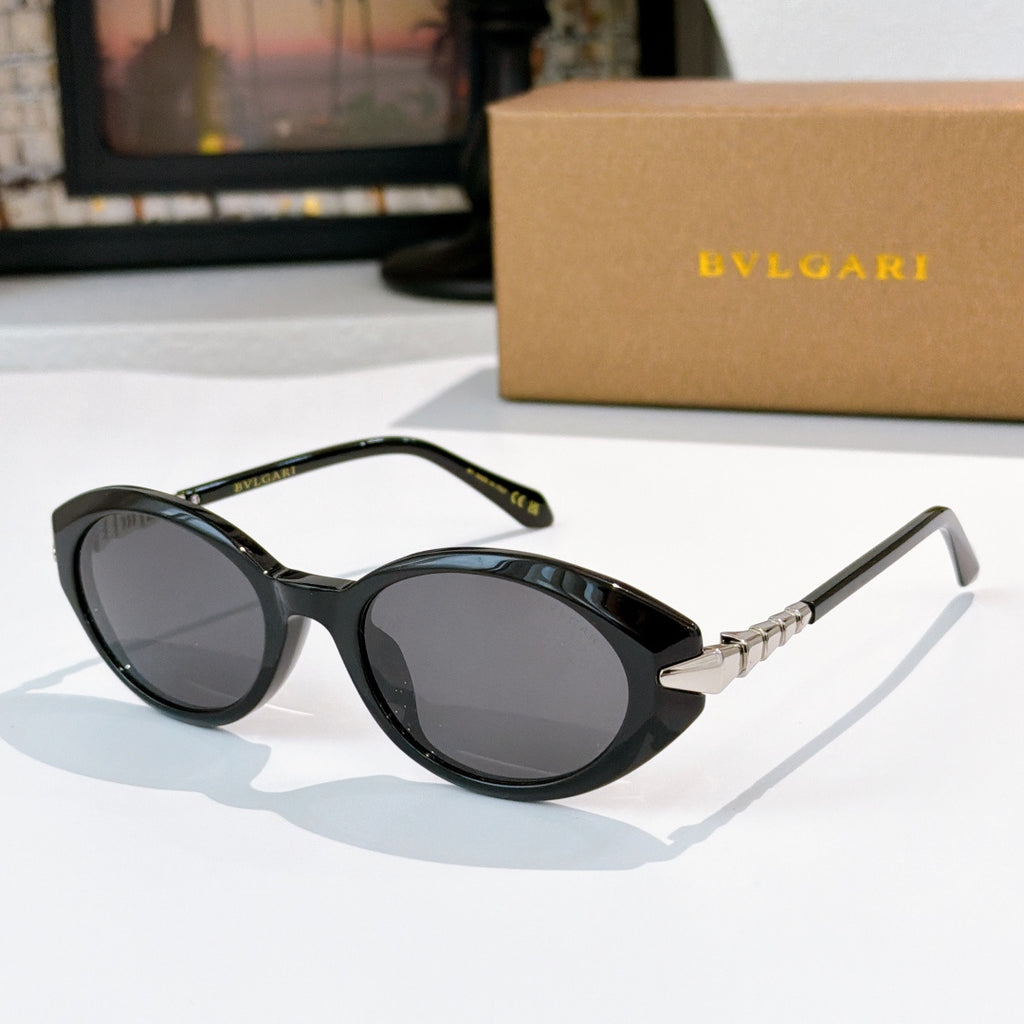 Bvlgari sunglasses with black frames and smoky gray lenses, gold hinge detail