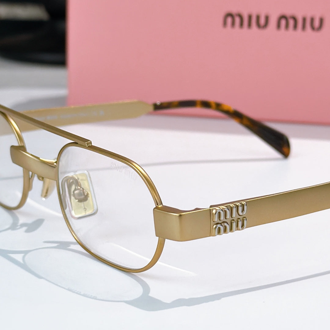 Gold-tone eyeglasses with clear lenses and engraved temple detail