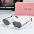 Gold-tone sunglasses with dark blue lenses and tortoiseshell temples