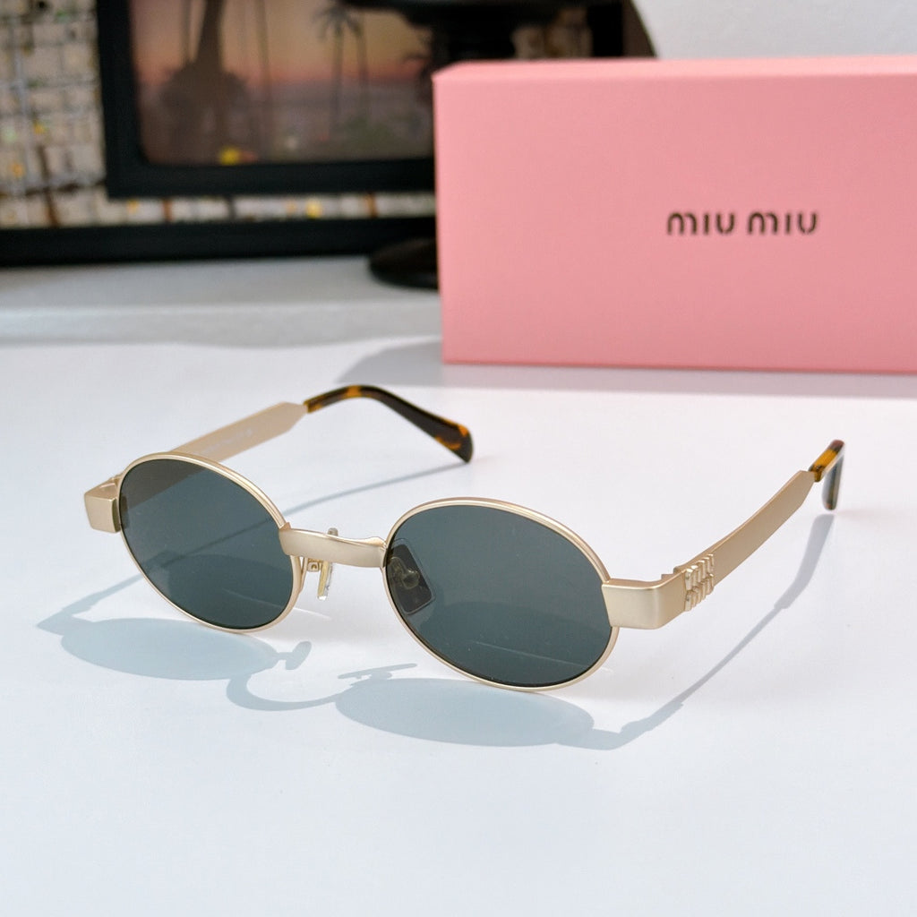 MiuMiu sunglasses with gold-tone round frames, deep teal lenses, tortoise-pattern temples