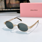 MiuMiu sunglasses with gold-tone round frames, deep teal lenses, tortoise-pattern temples