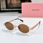 MiuMiu sunglasses with gold-tone round frames, brown lenses, tortoise-pattern temples